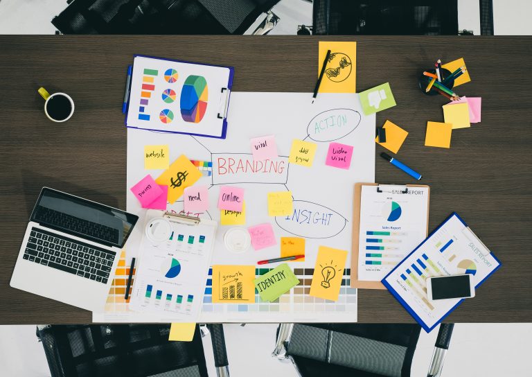 Top view of creative designer brainstorming ducument on wood table in meeting room